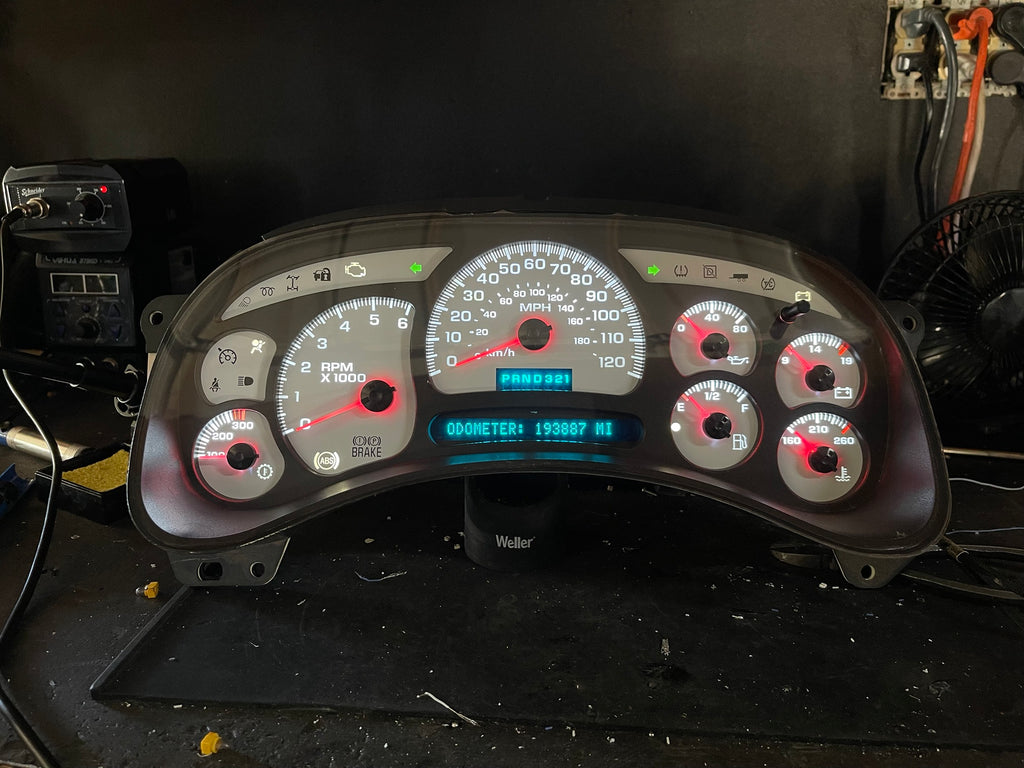 Rebuilt 2003-2007 Chevy/GMC gauge cluster lit up on the bench, stock look